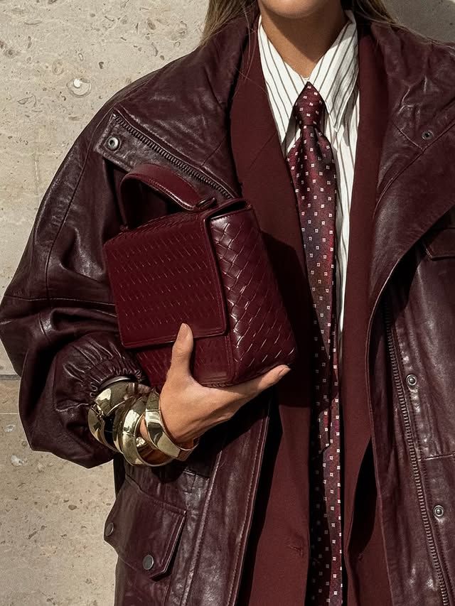 Oxblood leather jacket and woven leather bag