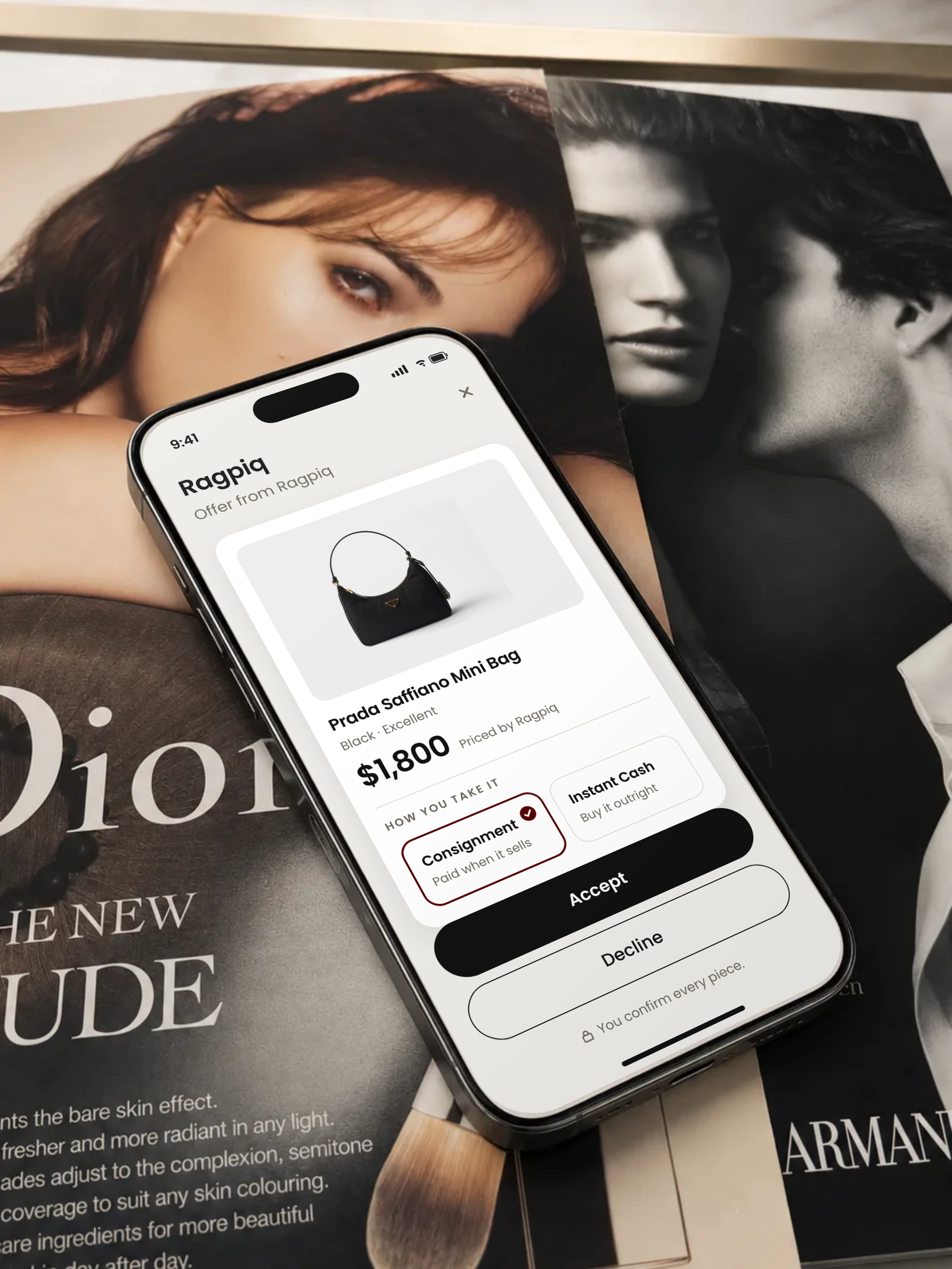 A phone on a stack of fashion magazines, showing an offer from Ragpiq with consignment or instant cash to choose from